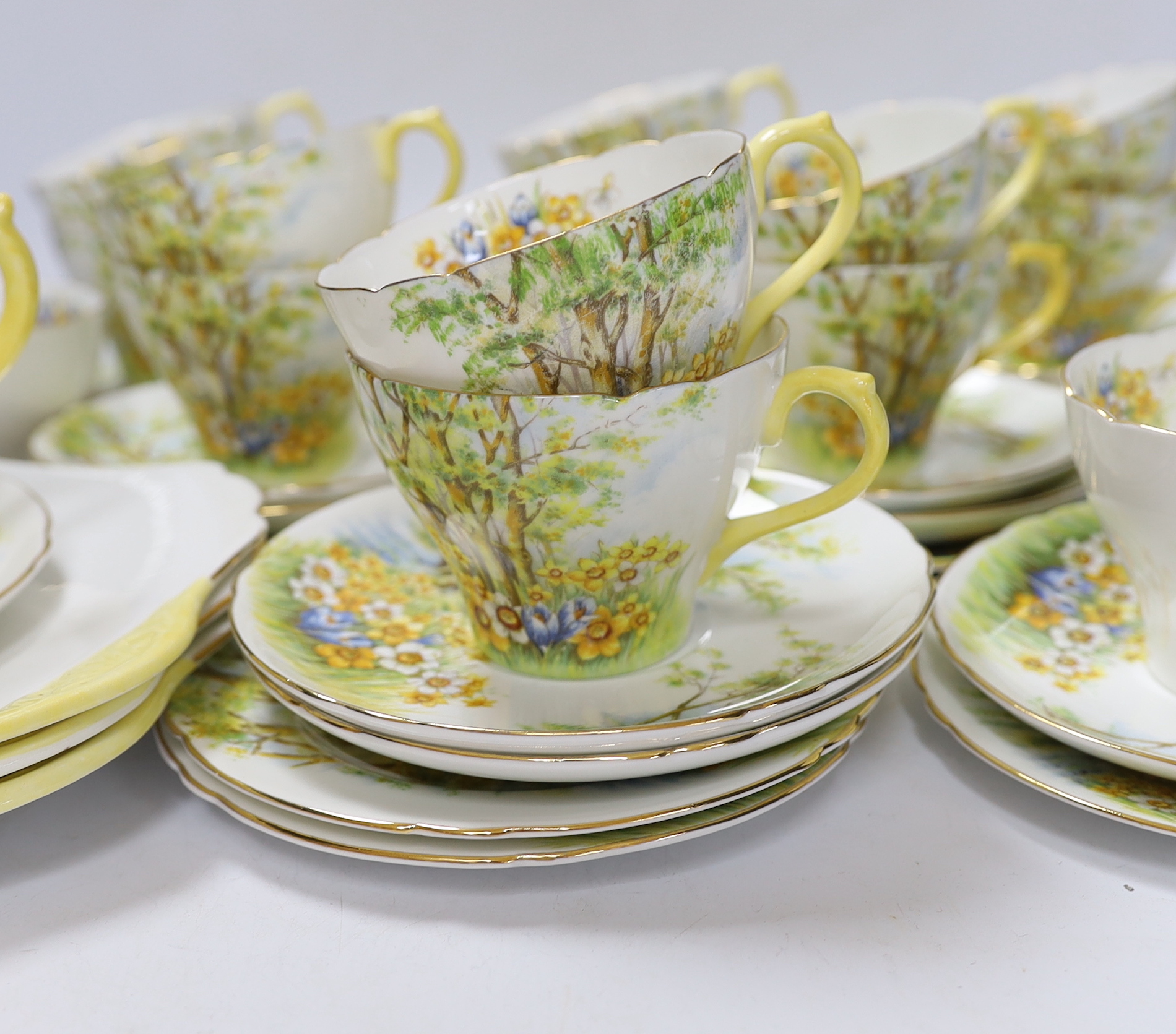 A Shelley ‘Daffodil Time’ pattern tea set with thirteen trios, three sandwich plates, milk jug and bowl, largest 24cm wide